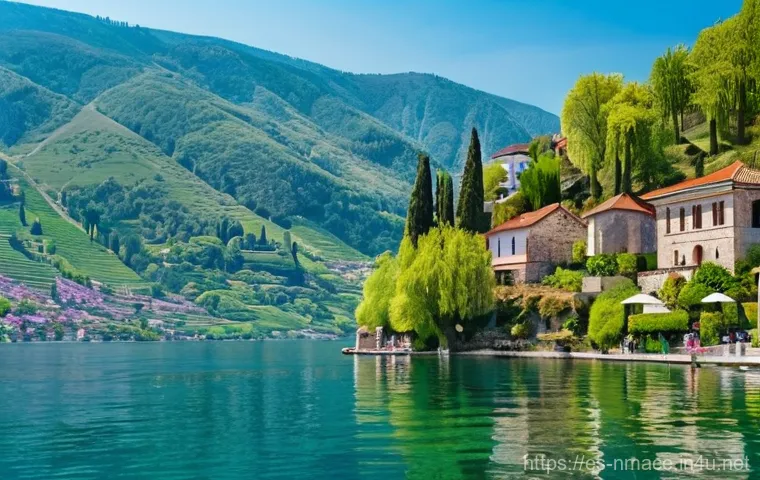 북마케도니아 기후 및 여행 시기 - **A serene spring morning at Lake Ohrid, North Macedonia.** The crystal-clear waters of the lake gen...